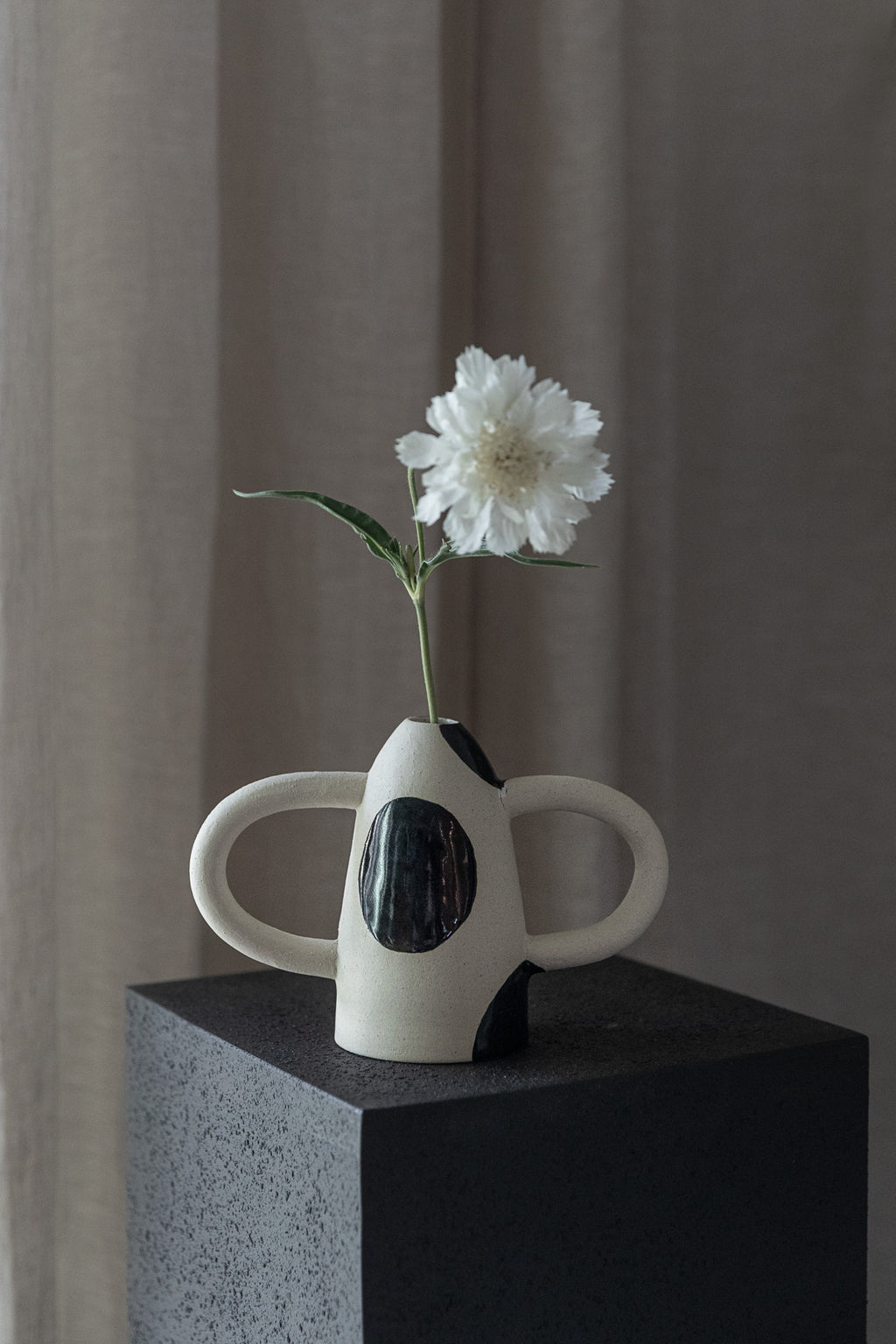 In Arms Vase
