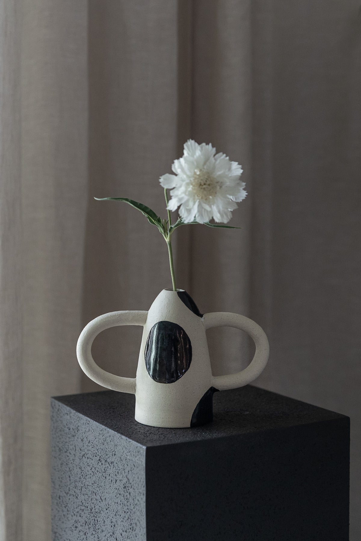 In Arms Vase