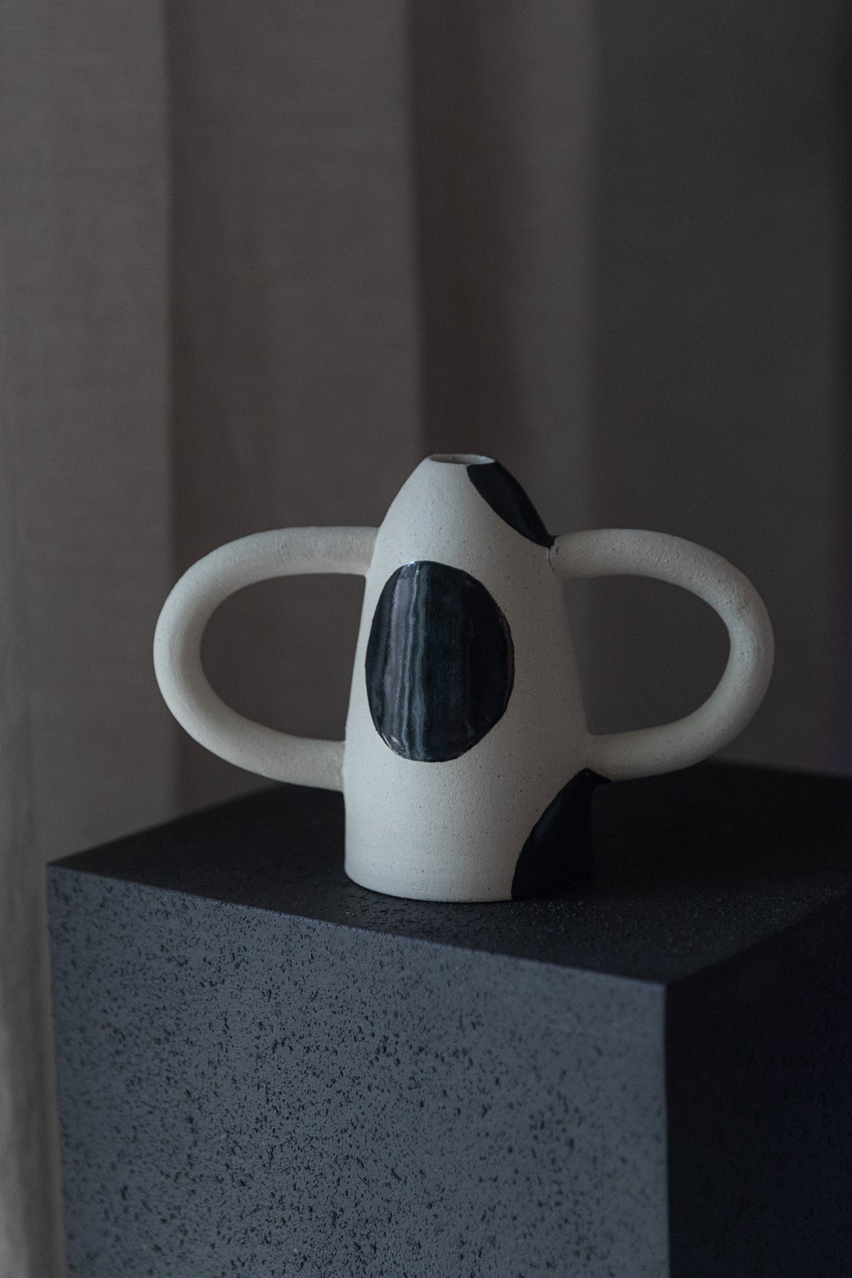 In Arms Vase